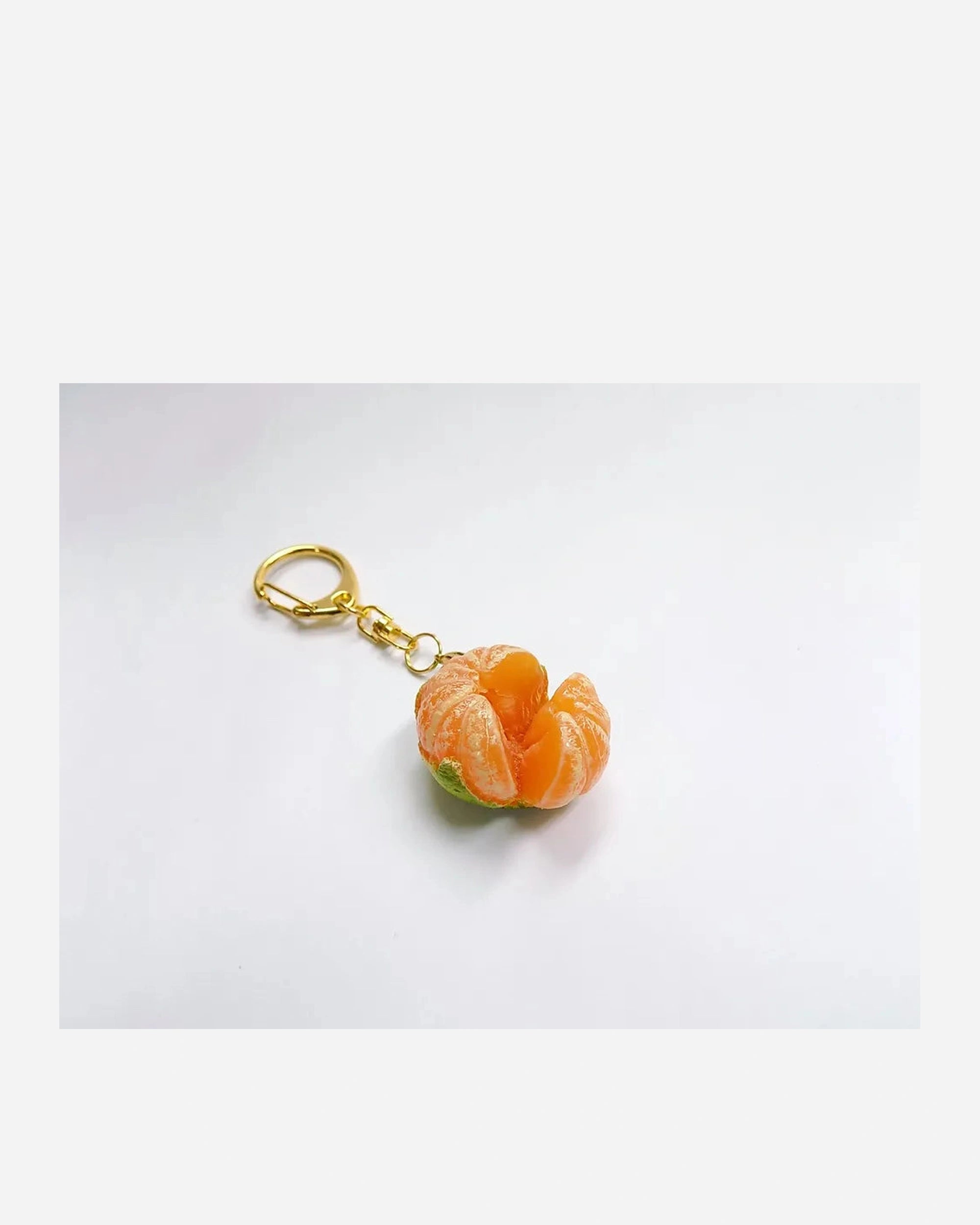 Small mandarin with green skin keychain