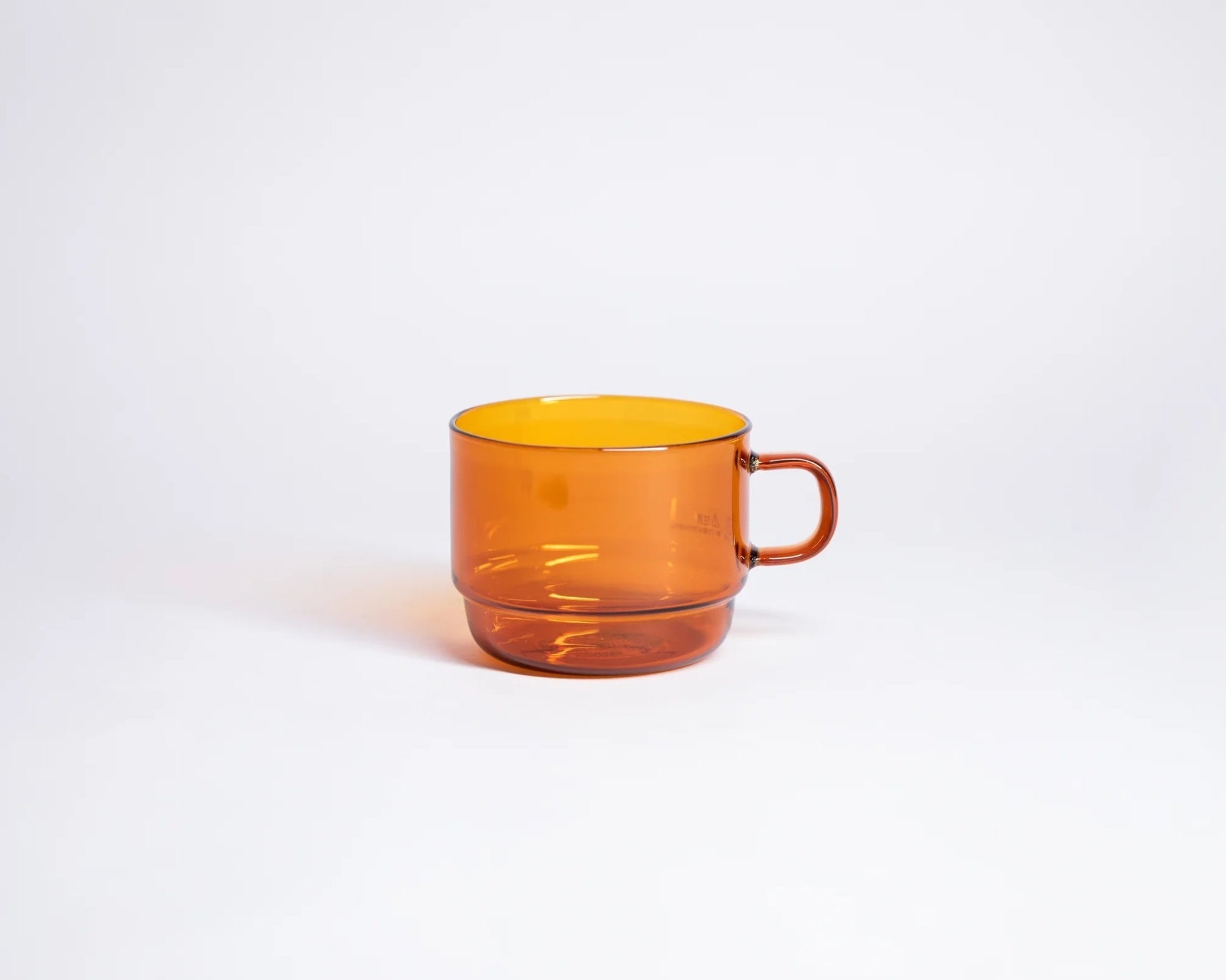 A photo of Glass stackable mug in amber