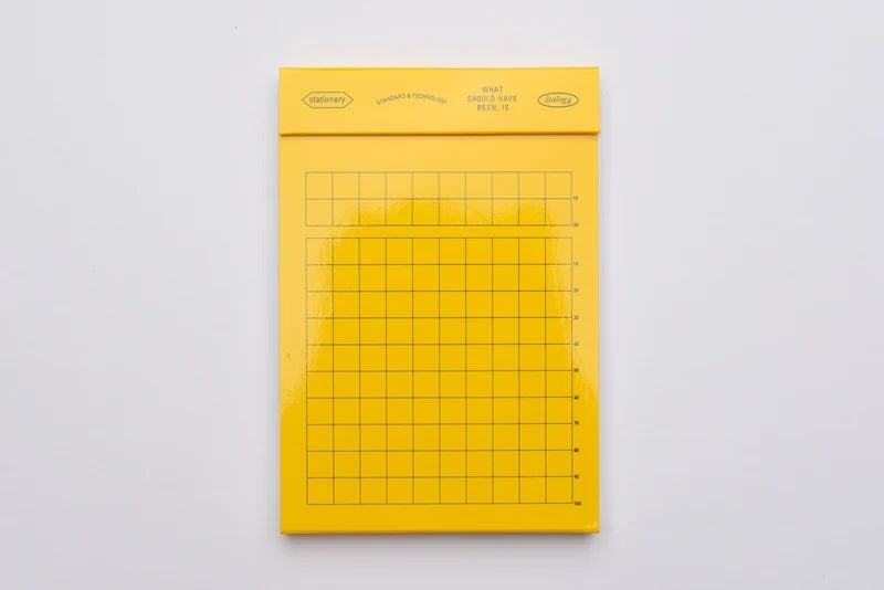 A photo of Stalogy 026 Editor’s Series Editor’s Memo Pad (Yellow / Grid)