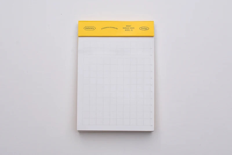 A photo of Stalogy 026 Editor’s Series Editor’s Memo Pad (Yellow / Grid)