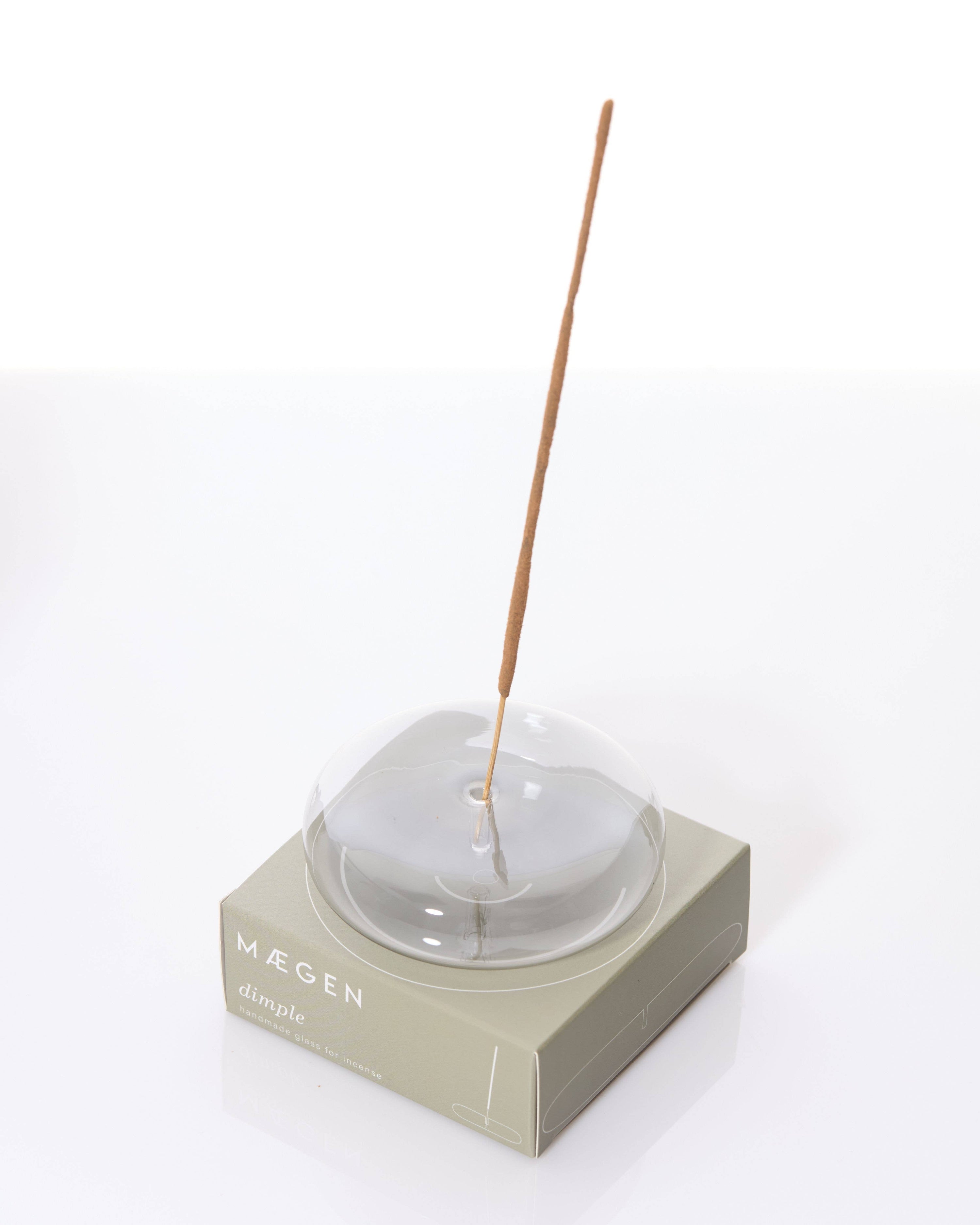 A photo of Dimple glass incense holder in gray