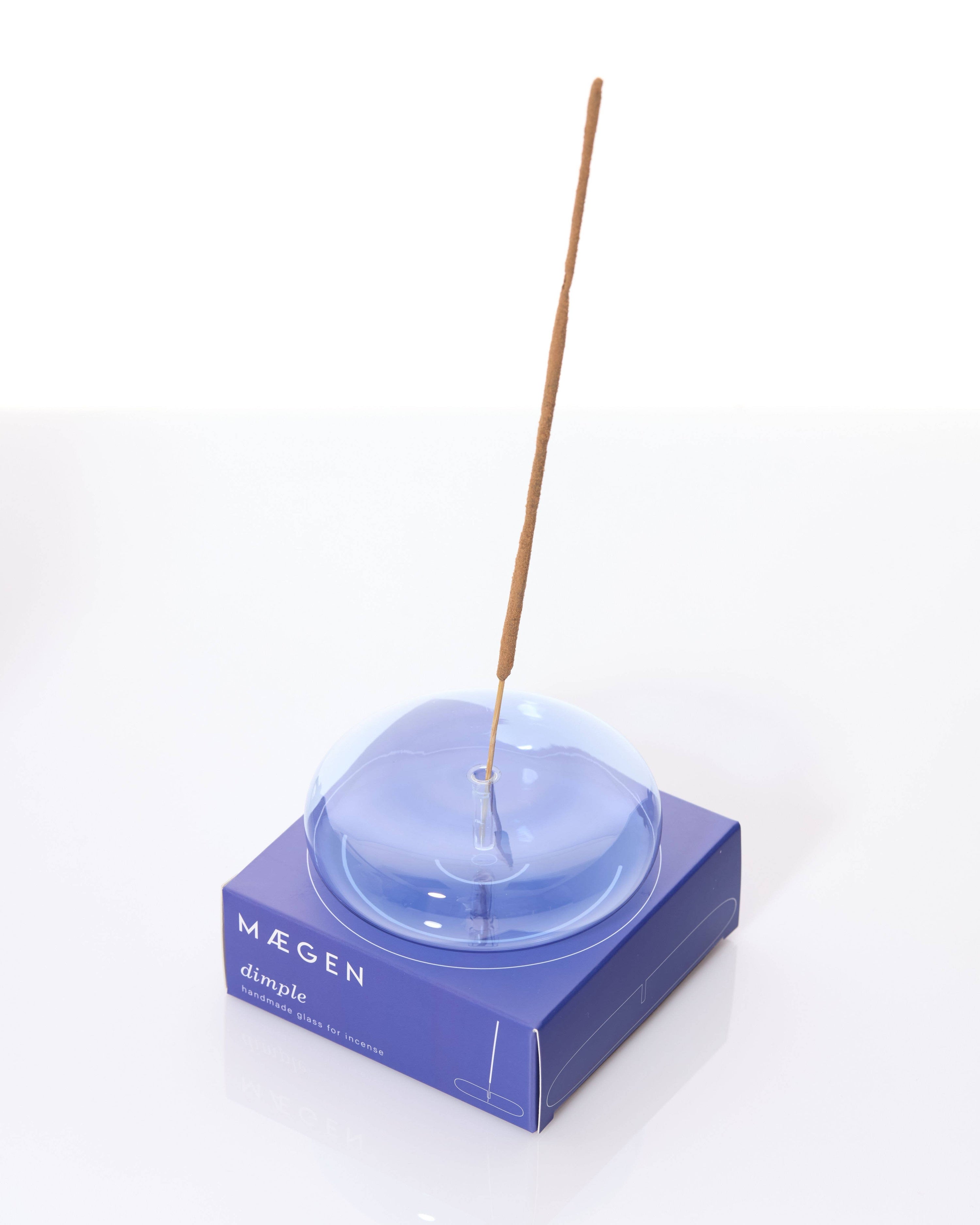 A photo of Dimple glass incense holder in blue