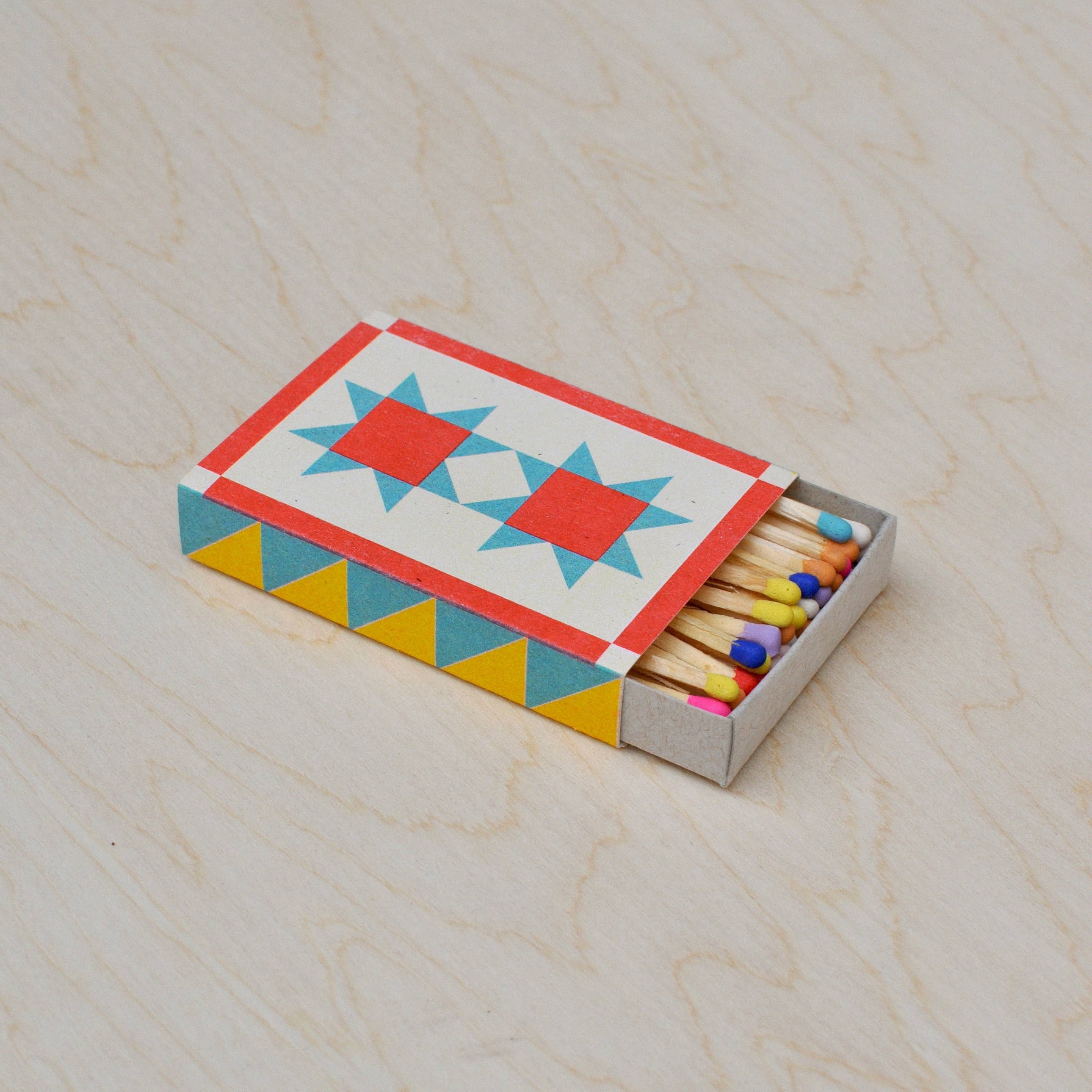 A photo of Quilt risograph printed matchbox